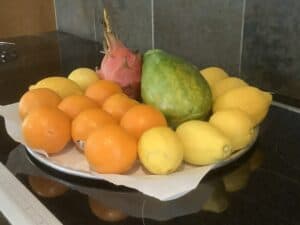 A Fruit Platter With A Papaya, Dragon Fruit and Citrus Fruit